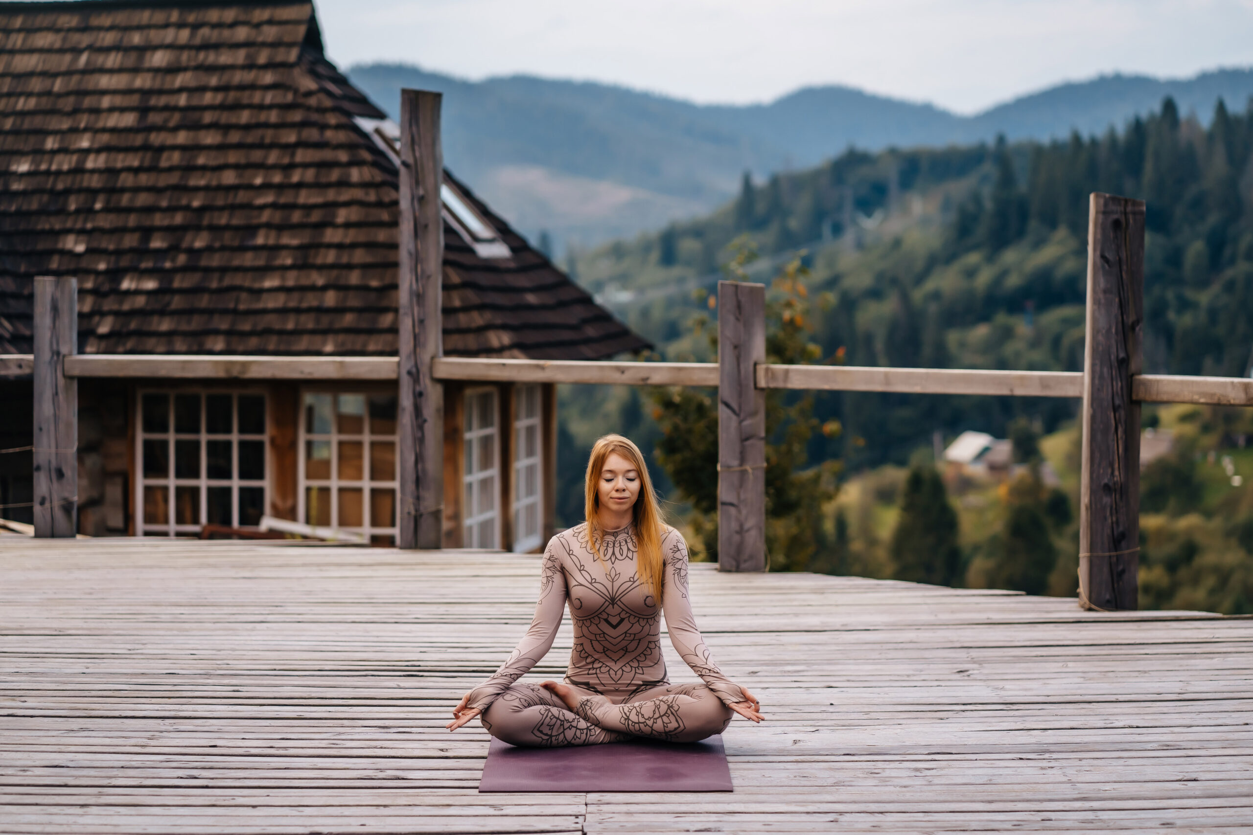 Woman practices yoga in mornin, fresh air.